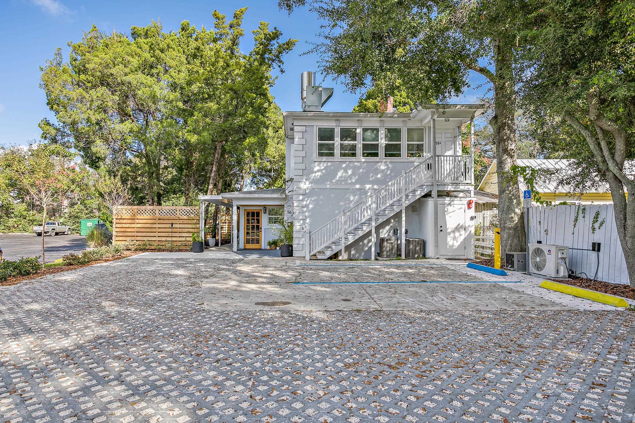 56 Grove Avenue St. Augustine, FL 32084 - Photo 2 of 48 a front view of a house with a yard