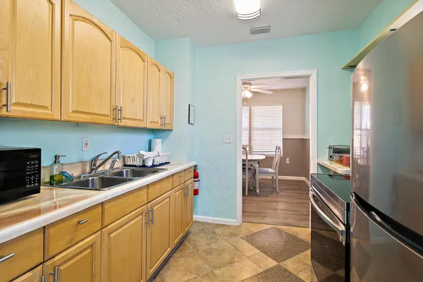 a view of a porch with wooden floor and stairs