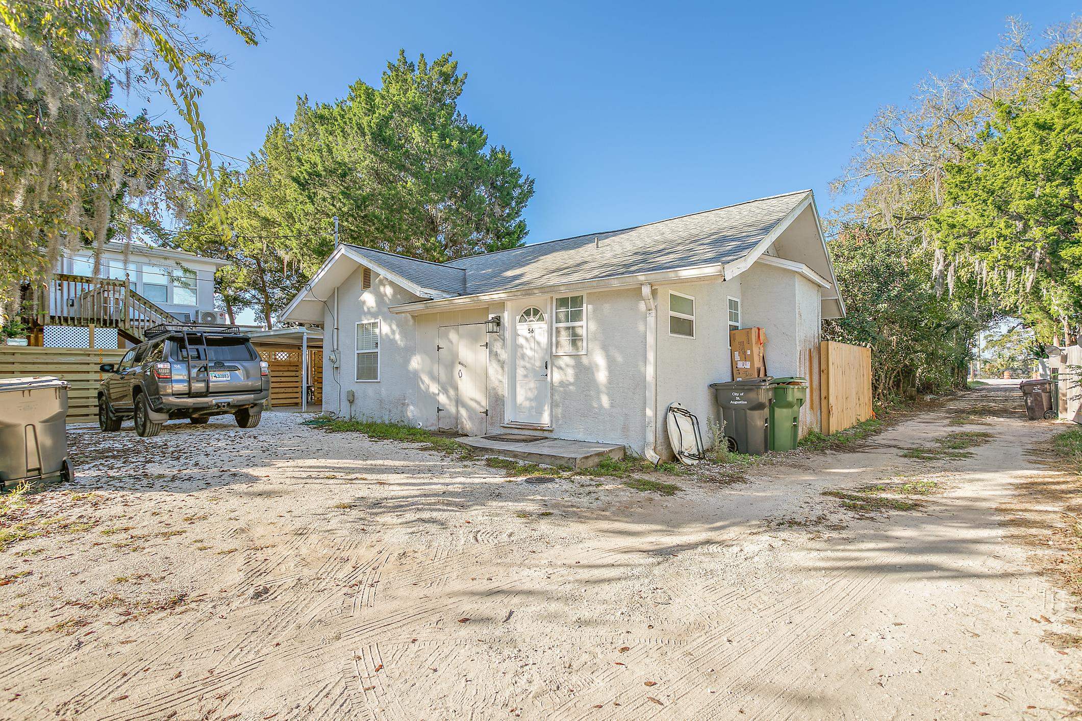 56 Grove Avenue St. Augustine, FL 32084 - Photo 28 of 48 a view of a yard with a house and a tree