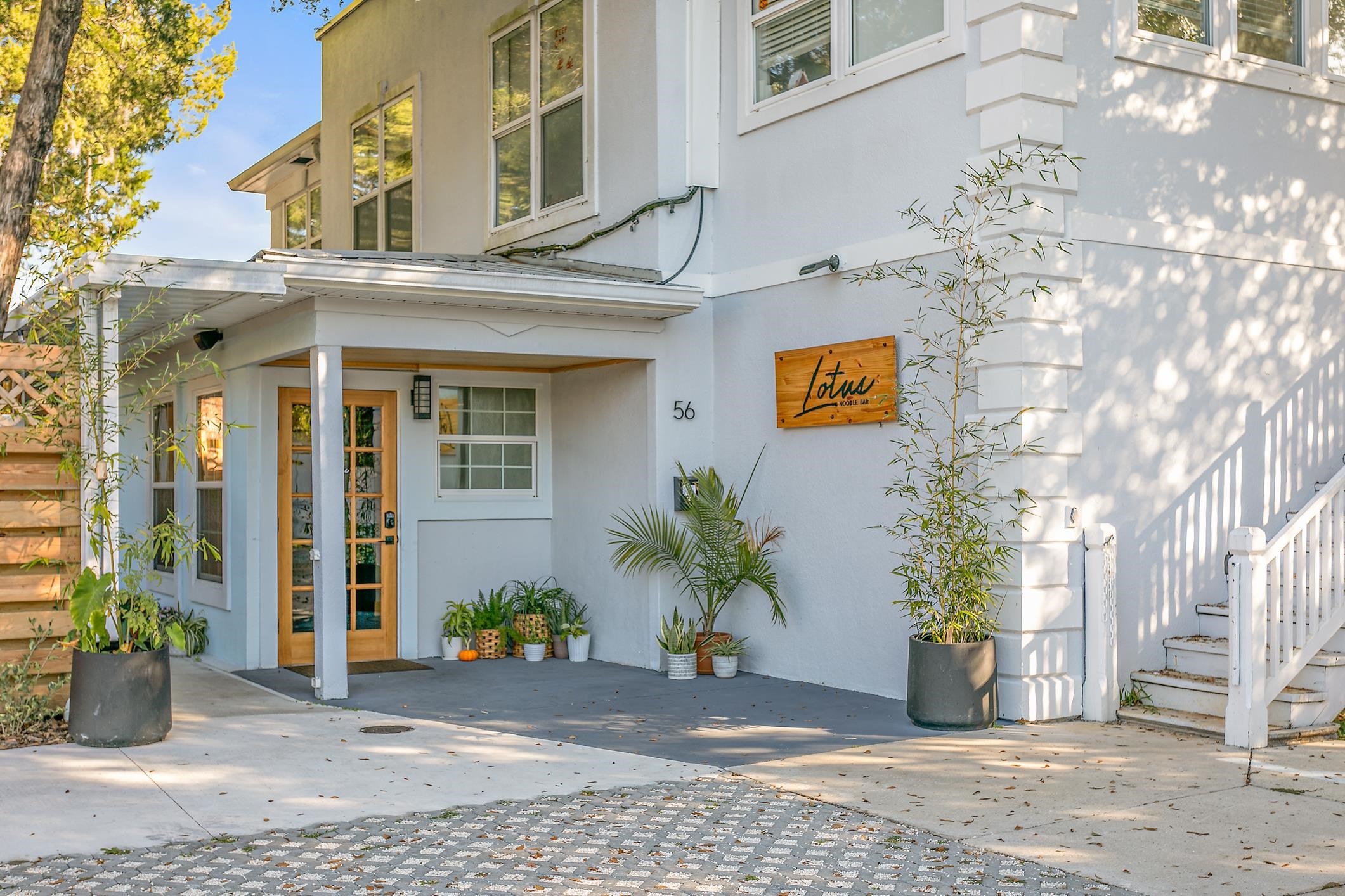 56 Grove Avenue St. Augustine, FL 32084 - Photo 3 of 48 a view of a building with potted plants