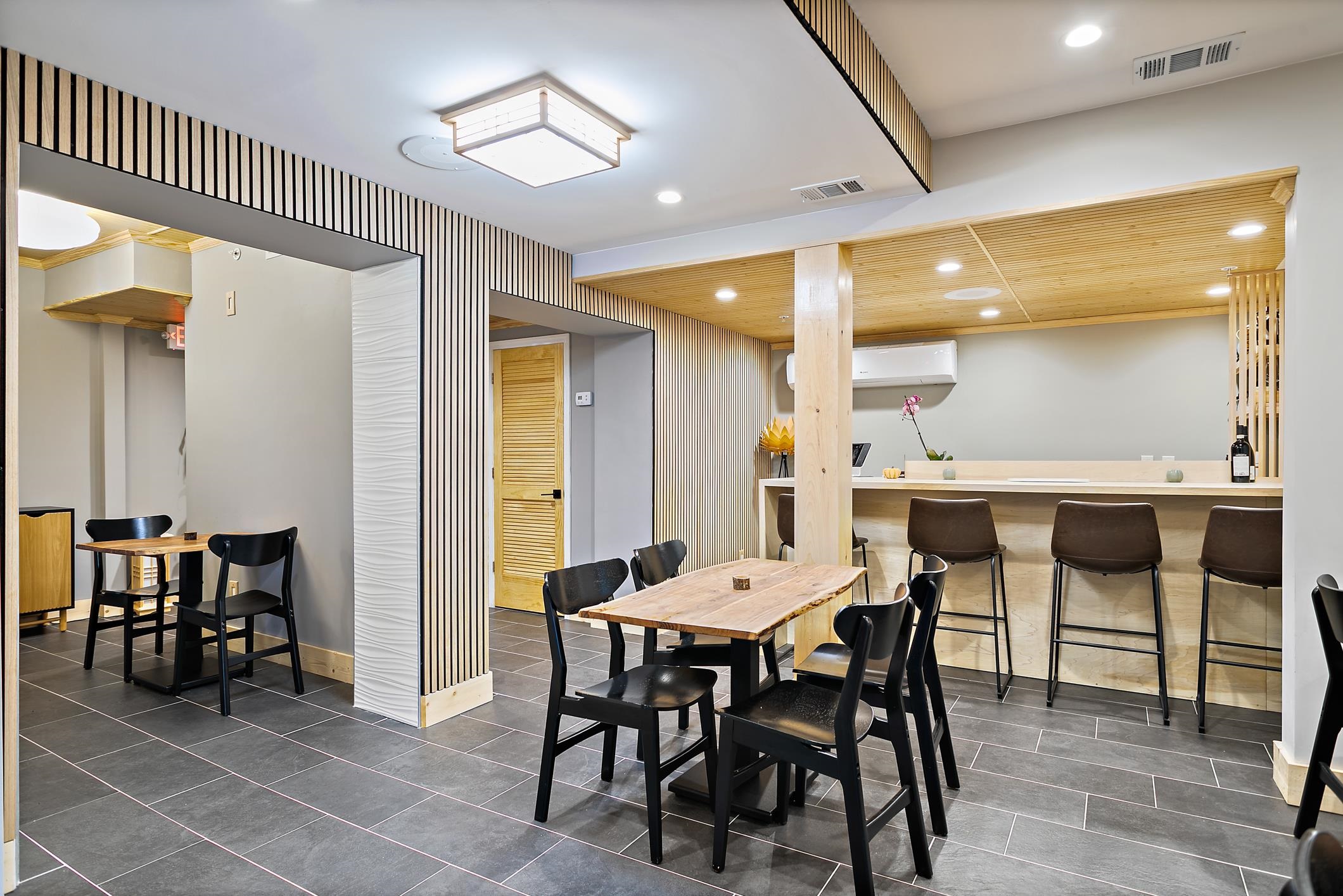 56 Grove Avenue St. Augustine, FL 32084 - Photo 31 of 48 a dining hall with stainless steel appliances a table and chairs