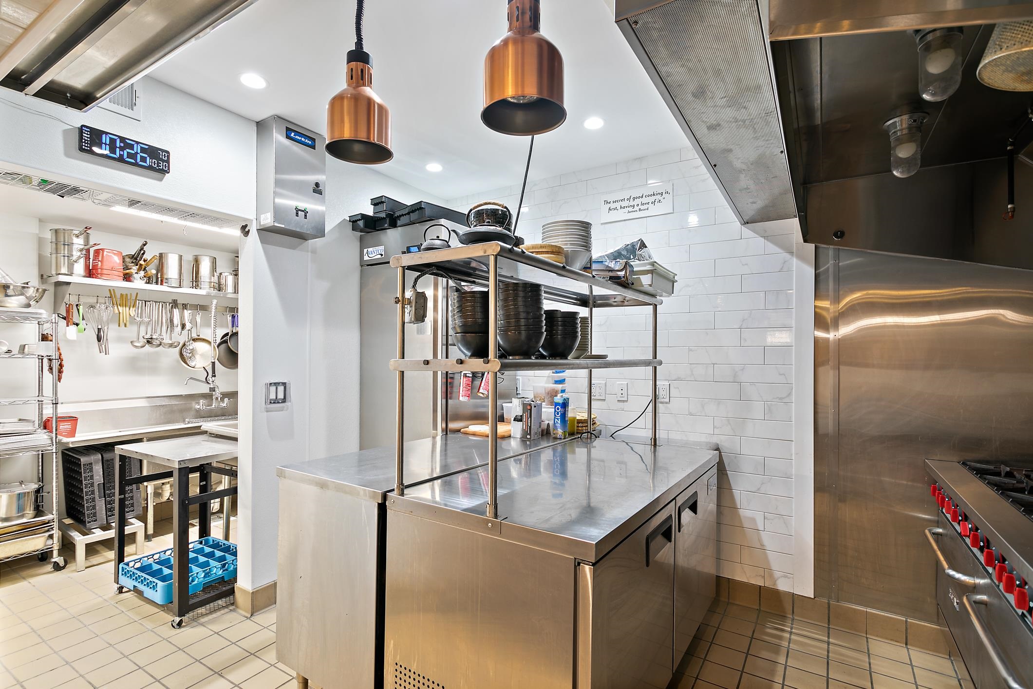 56 Grove Avenue St. Augustine, FL 32084 - Photo 36 of 48 a kitchen with stainless steel appliances granite countertop a sink and a refrigerator