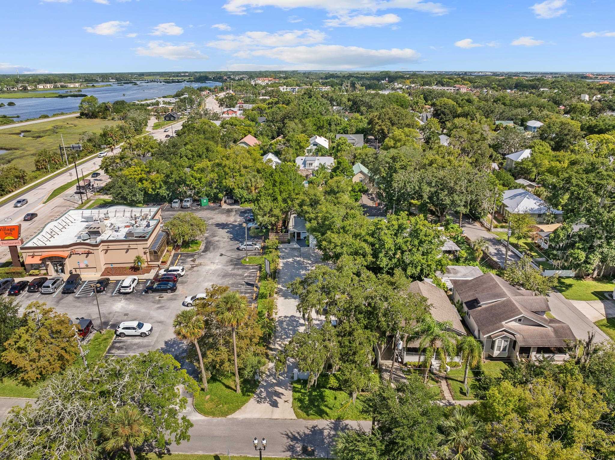 56 Grove Avenue St. Augustine, FL 32084 - Photo 38 of 48 an aerial view of residential houses with outdoor space and trees