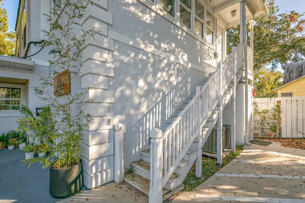 a view of a house with a tree