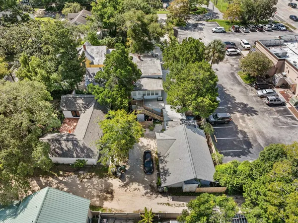 an aerial view of residential houses with outdoor space