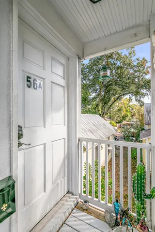 a view of a house with a porch and furniture