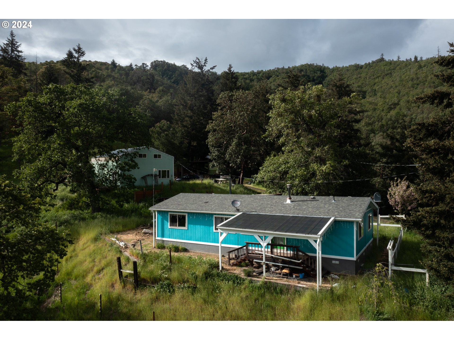 1120 Clarks Branch Road Myrtle Creek, OR 97457 - Photo 1 of 37 an aerial view of a house with a garden