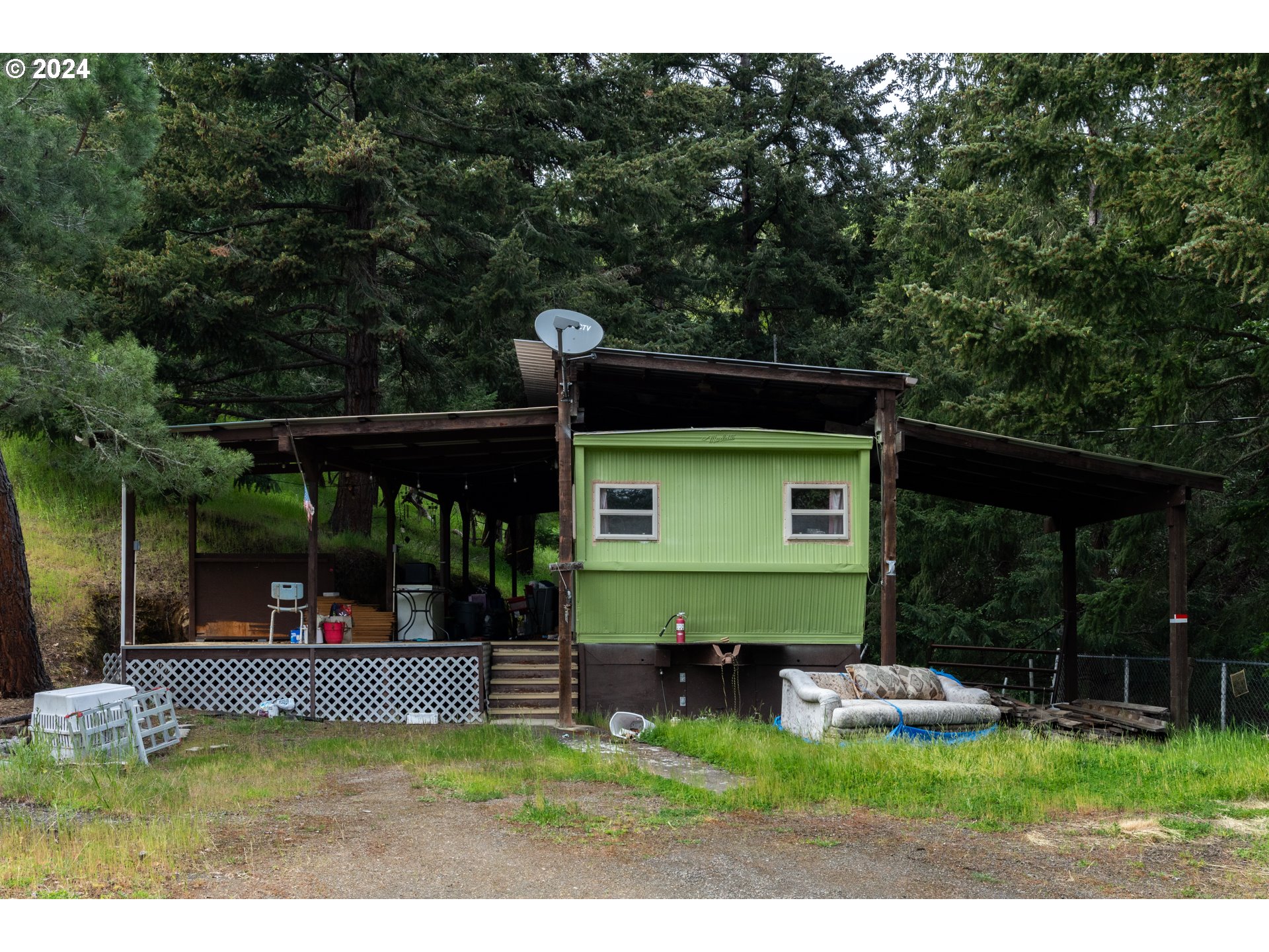 1120 Clarks Branch Road Myrtle Creek, OR 97457 - Photo 22 of 37 a view of a porch with a yard