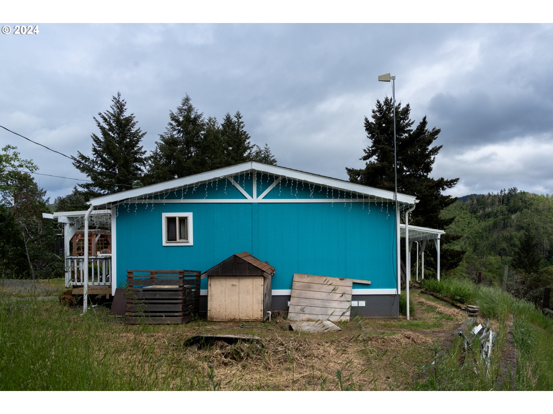 1120 Clarks Branch Road Myrtle Creek, OR 97457 - Photo 27 of 37 a front view of a house with garden