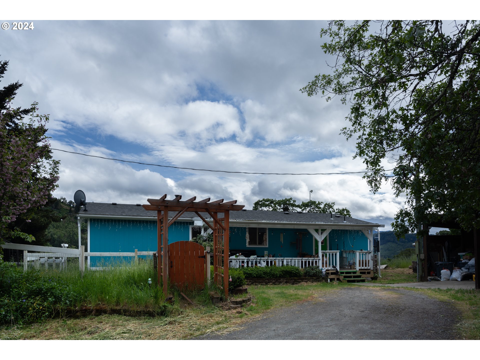 1120 Clarks Branch Road Myrtle Creek, OR 97457 - Photo 5 of 37 a view of house with yard and entertaining space