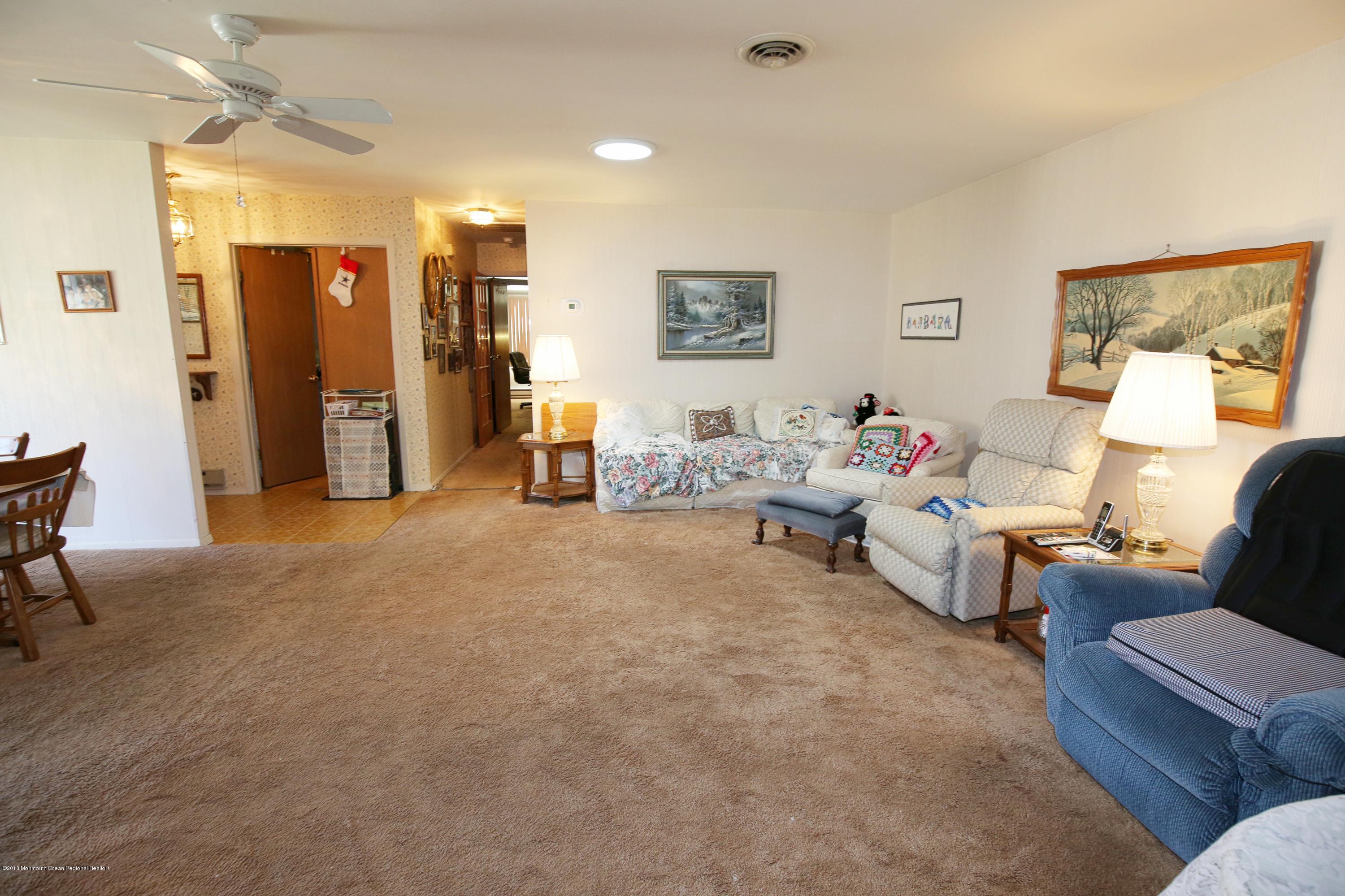 30A Mill Road, Unit C Whiting, NJ 08759 - Photo 9 of 23 a bed room with furniture and a window