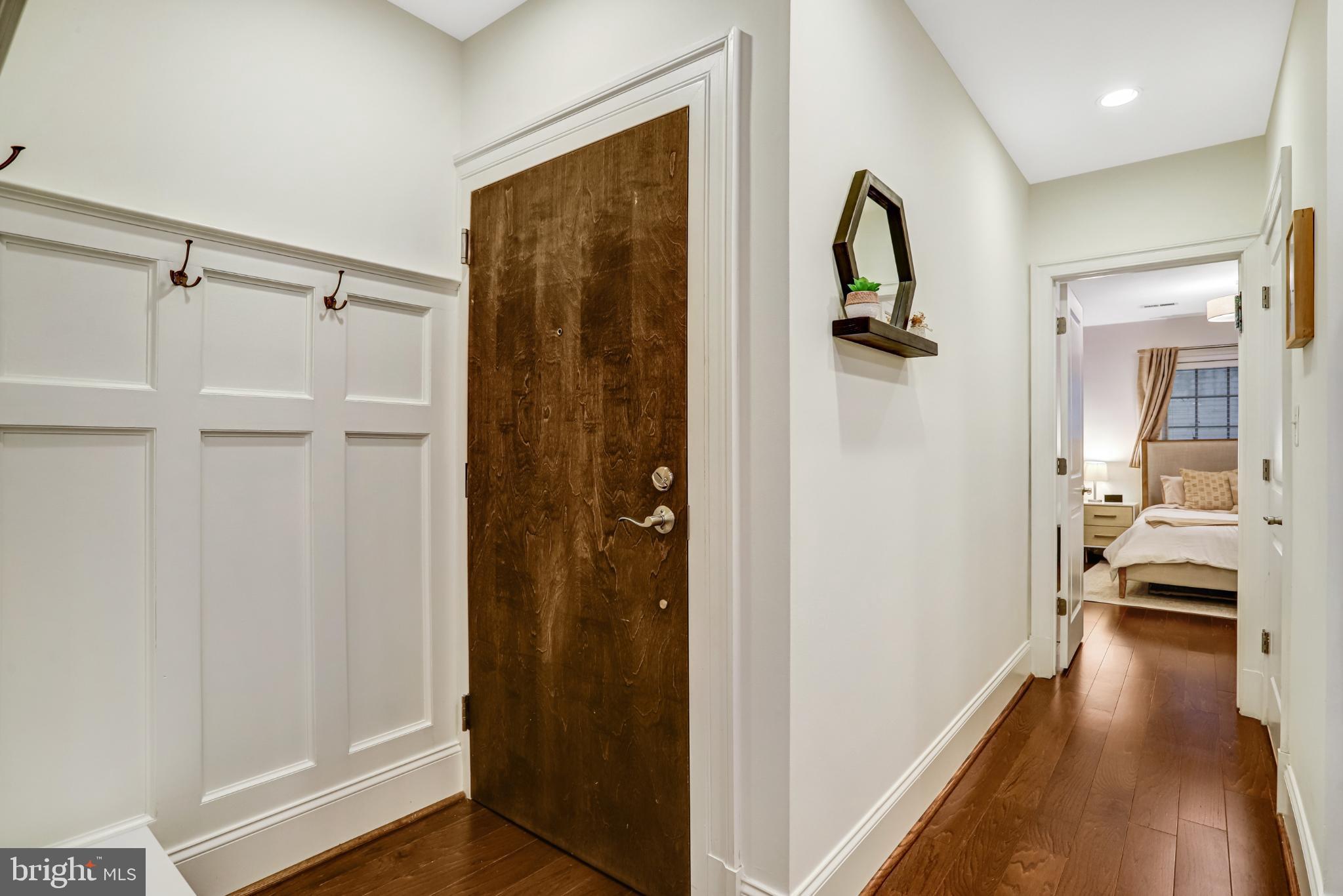3937 Davis Place Northwest, Unit 1 Washington, DC 20007 - Photo 11 of 22 a view of a hallway view with bedroom and wooden floor