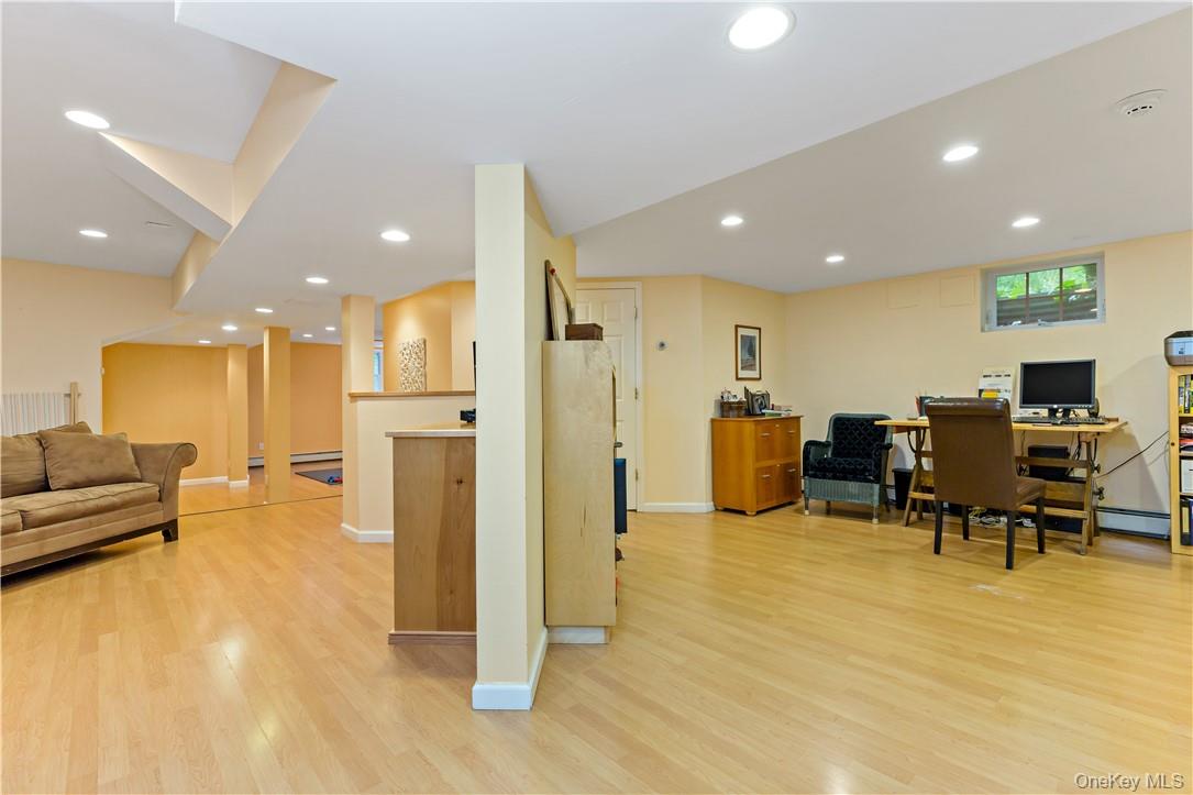 52 Old Manitou Road Garrison, NY 10524 - Photo 21 of 33 Lower level offers even more space. Family/rec room on the left, office space on the right, full bath and exercise room in the background.