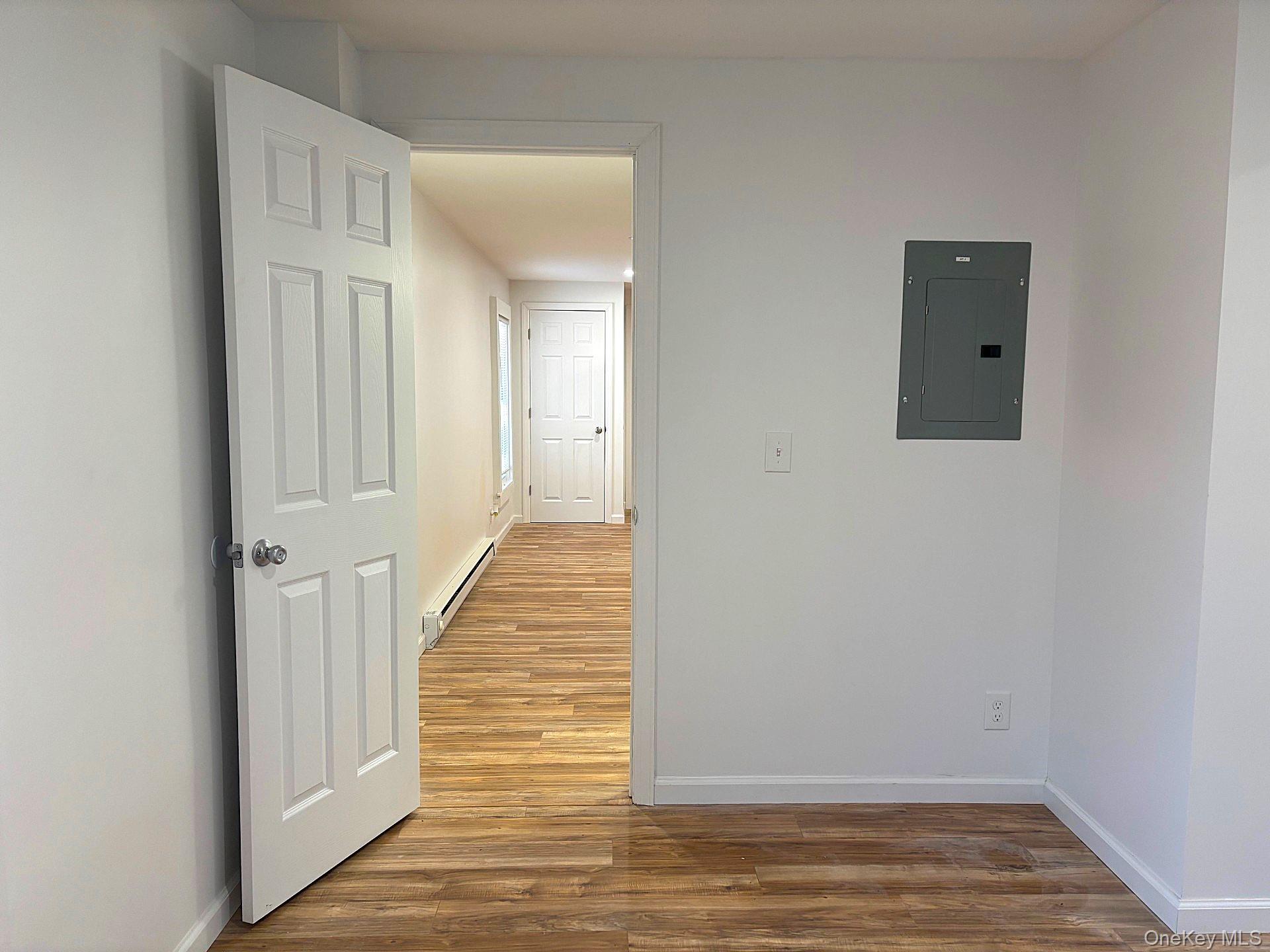 447 Highway 376, Unit 2 Hopewell Junction, NY 12533 - Photo 11 of 12 a view of a hallway with wooden floor
