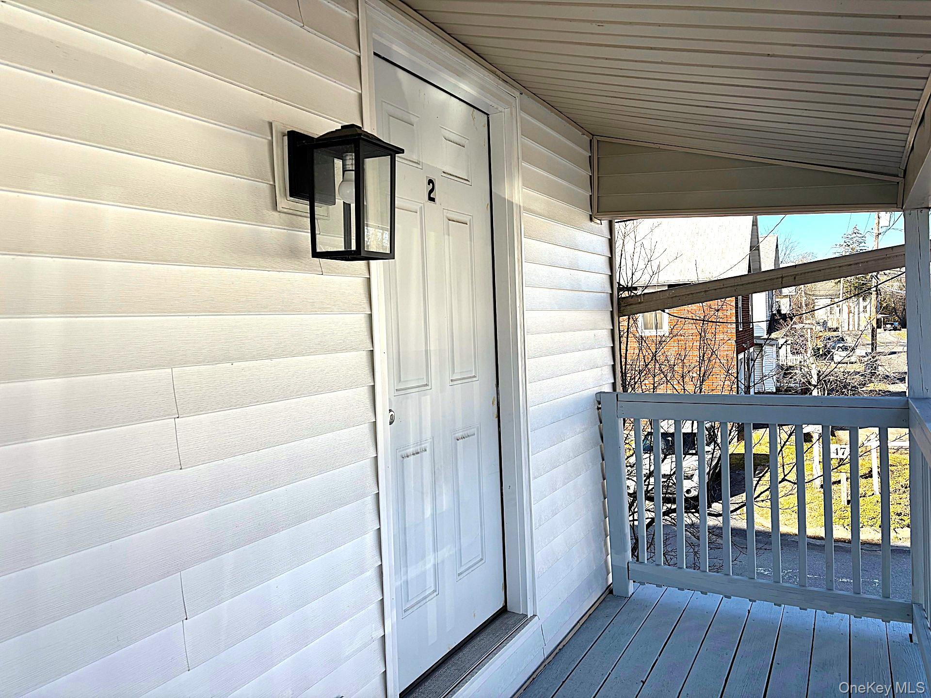 447 Highway 376, Unit 2 Hopewell Junction, NY 12533 - Photo 2 of 12 a view of a porch with wooden floor