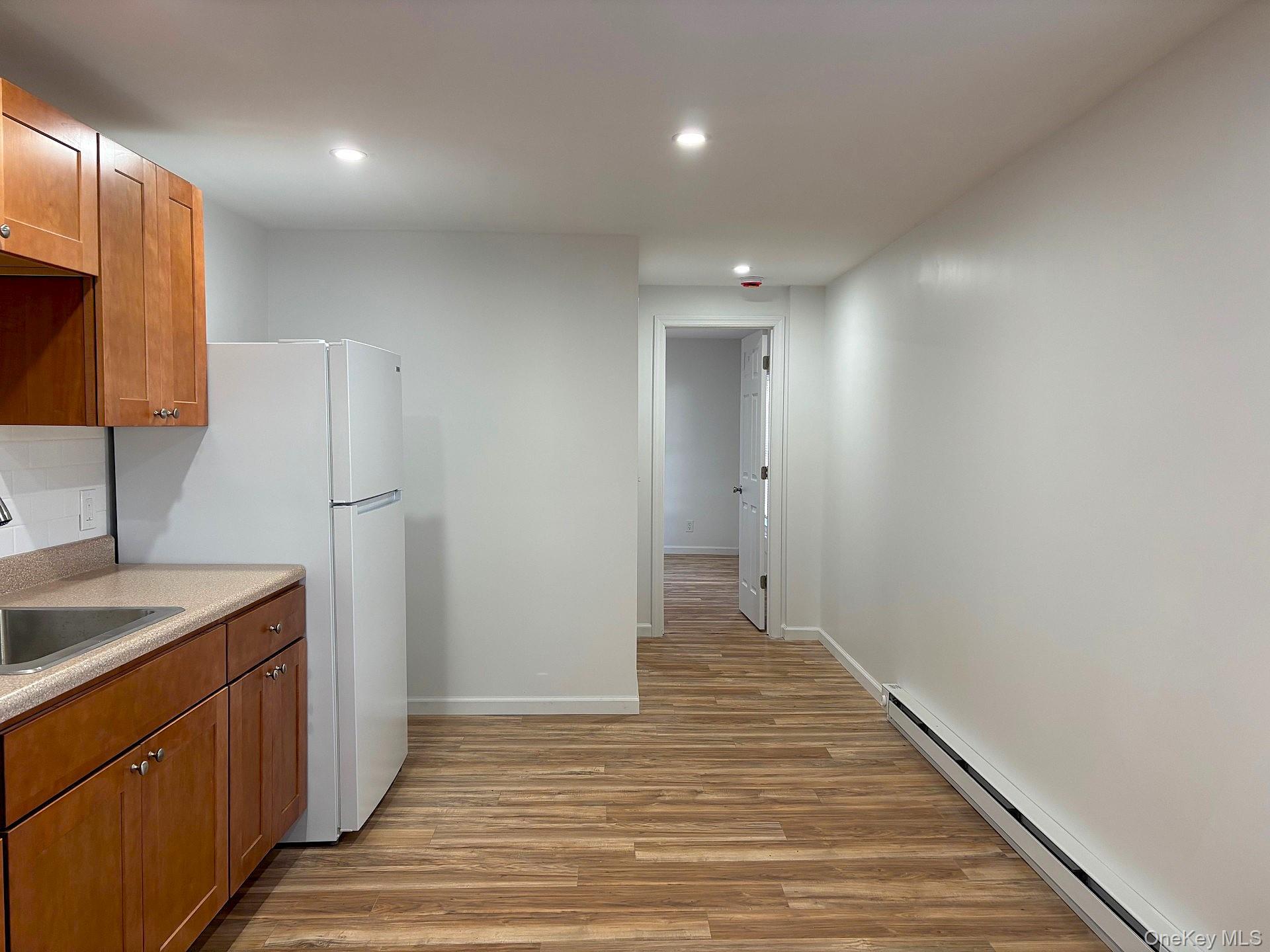 447 Highway 376, Unit 2 Hopewell Junction, NY 12533 - Photo 6 of 12 a view of a kitchen from the hallway