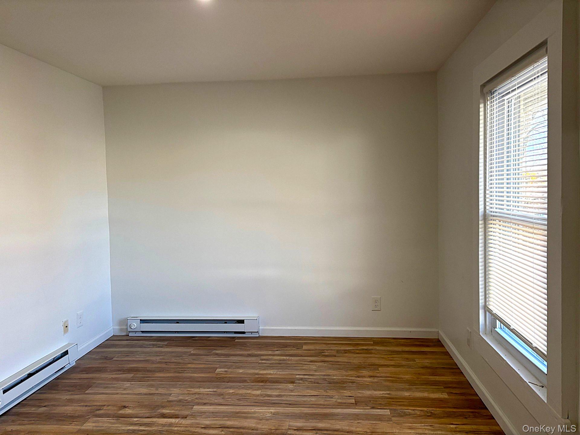 447 Highway 376, Unit 2 Hopewell Junction, NY 12533 - Photo 8 of 12 a view of an empty room and window