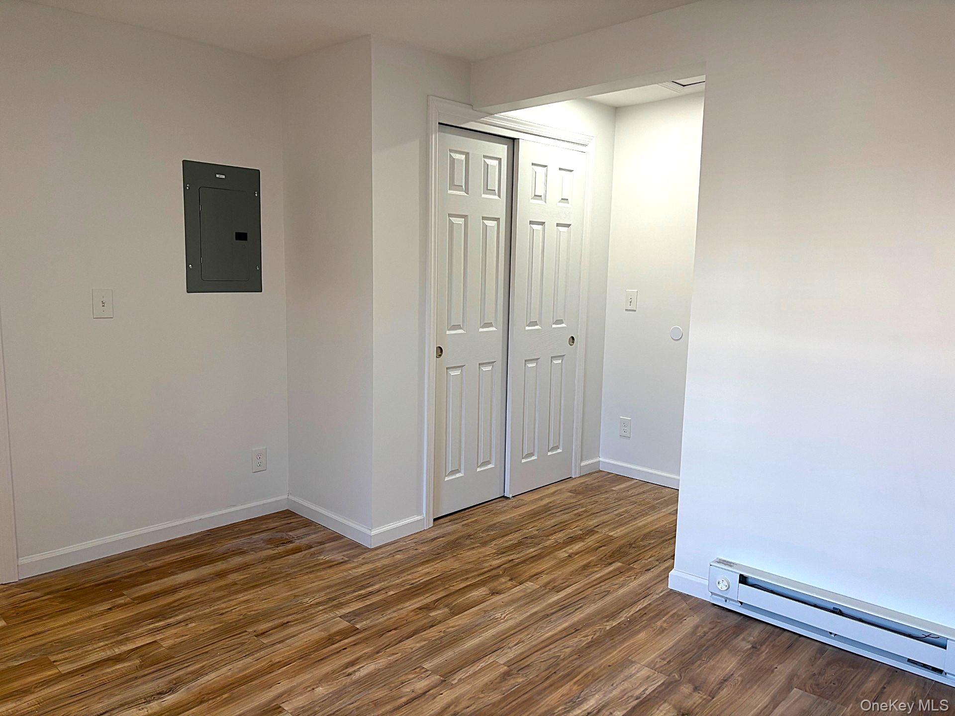 447 Highway 376, Unit 2 Hopewell Junction, NY 12533 - Photo 9 of 12 a view of a room with wooden floor