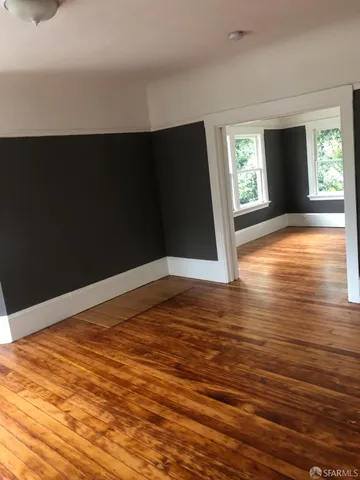a view of livingroom with hardwood floor and hallway