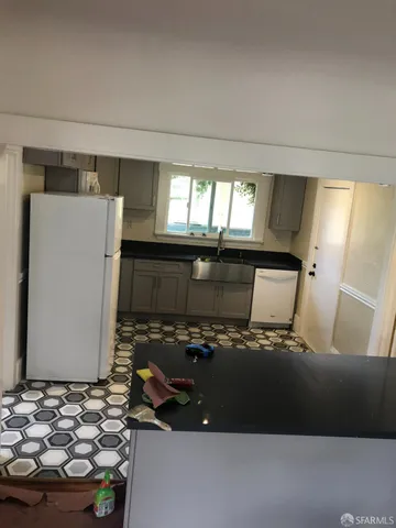 a view of bathroom with sink bathtub and window