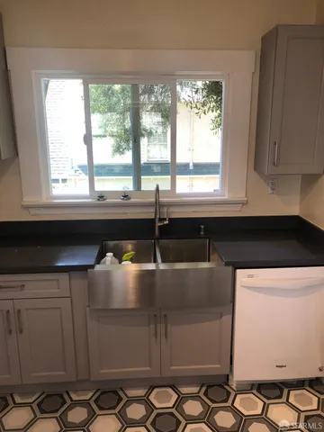 a kitchen with stainless steel appliances a stove and a microwave