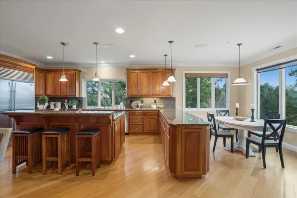 a kitchen with stainless steel appliances granite countertop lots of counter top space