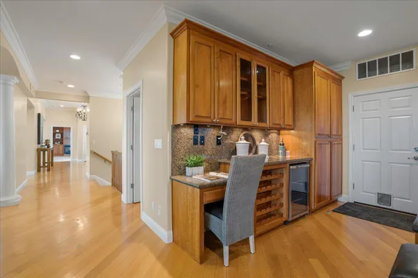 a view of a dining room with furniture large windows and wooden floor