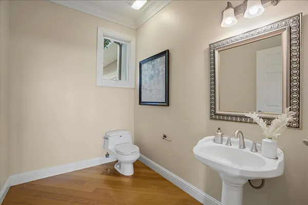 a spacious bedroom with a bed a table and a large window