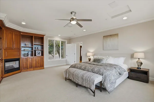 a bedroom with a bed and glass window
