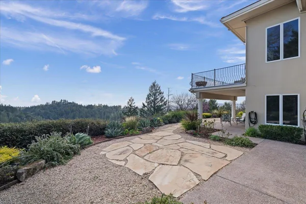 a view of a house with a sink and a yard