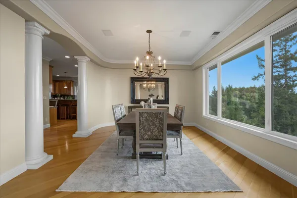a view of a dining room with furniture window and wooden floor