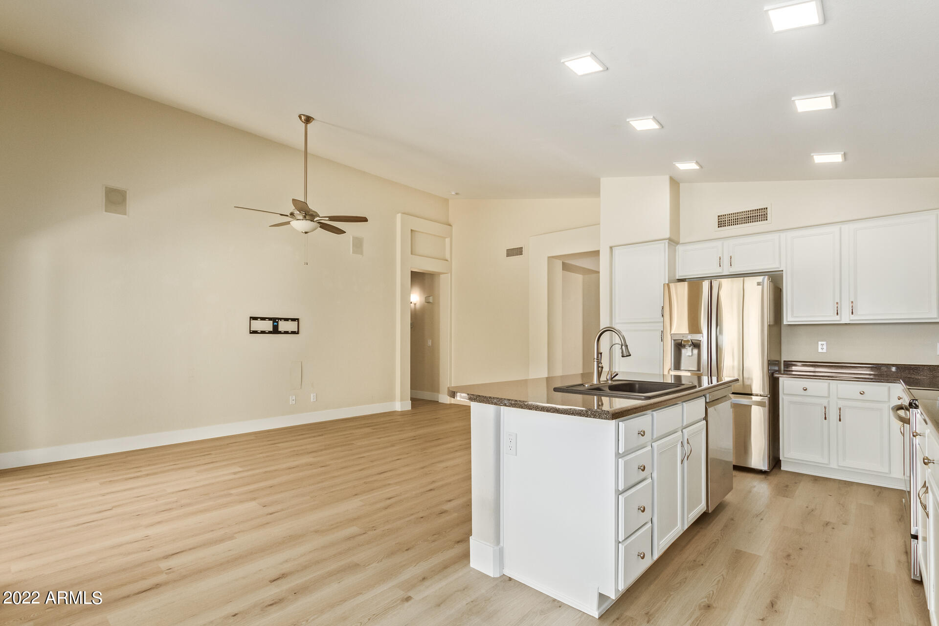 1647 East Heather Avenue Gilbert, AZ 85234 - Photo 13 of 27 a kitchen with stainless steel appliances granite countertop a sink stove and refrigerator