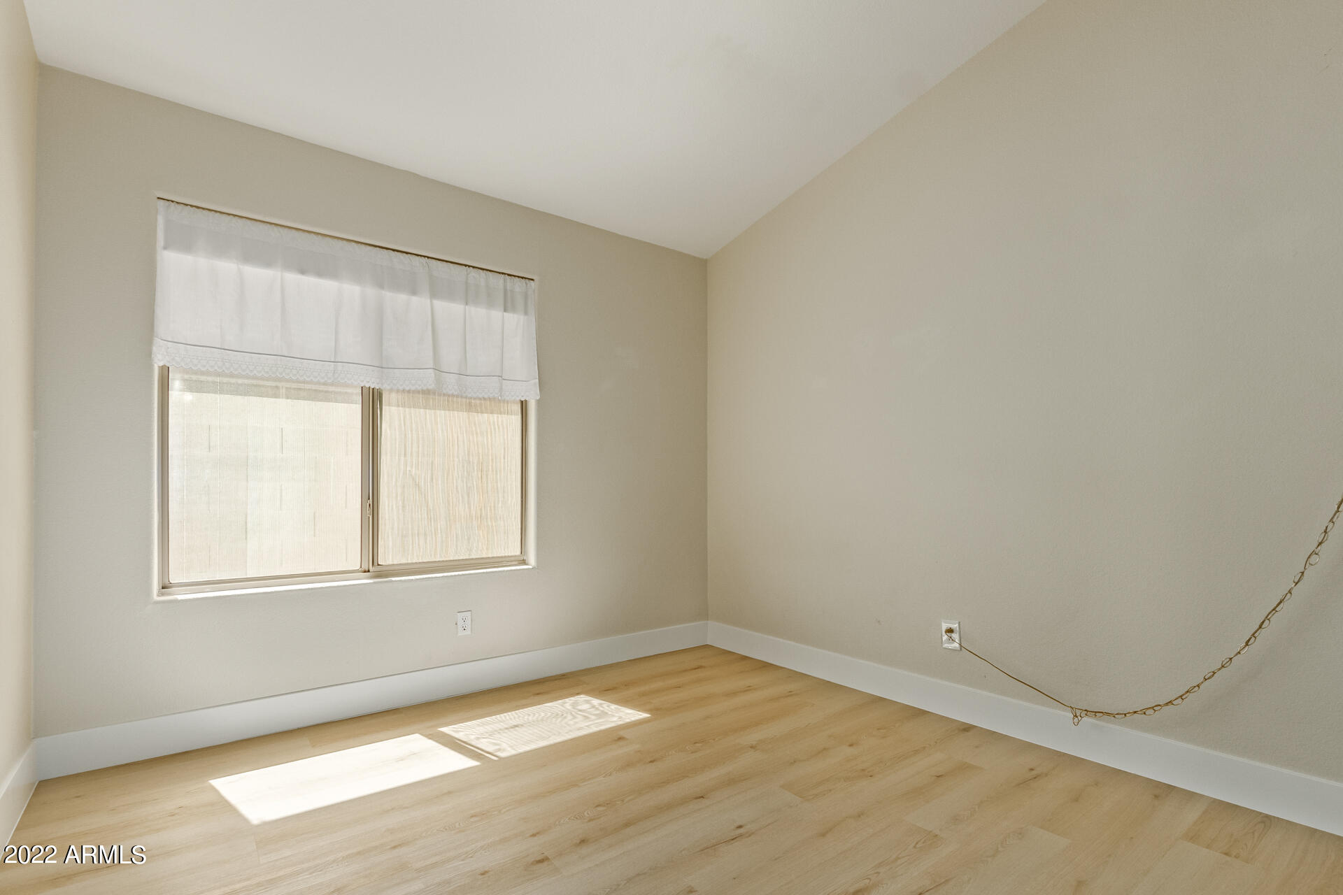 1647 East Heather Avenue Gilbert, AZ 85234 - Photo 17 of 27 an empty room with wooden floor and windows
