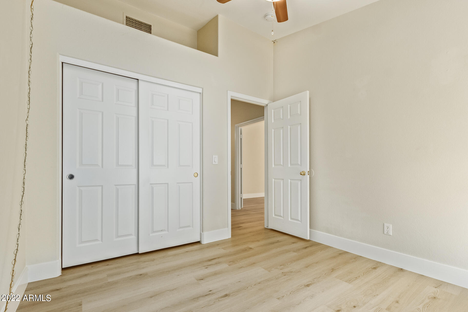 1647 East Heather Avenue Gilbert, AZ 85234 - Photo 18 of 27 an empty room with wooden floor