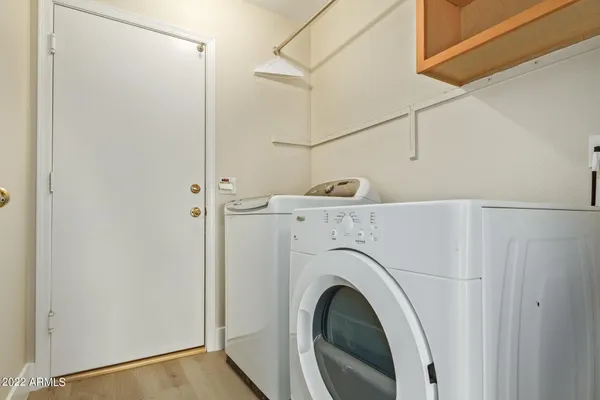 a view of a storage & utility room with washer and dryer