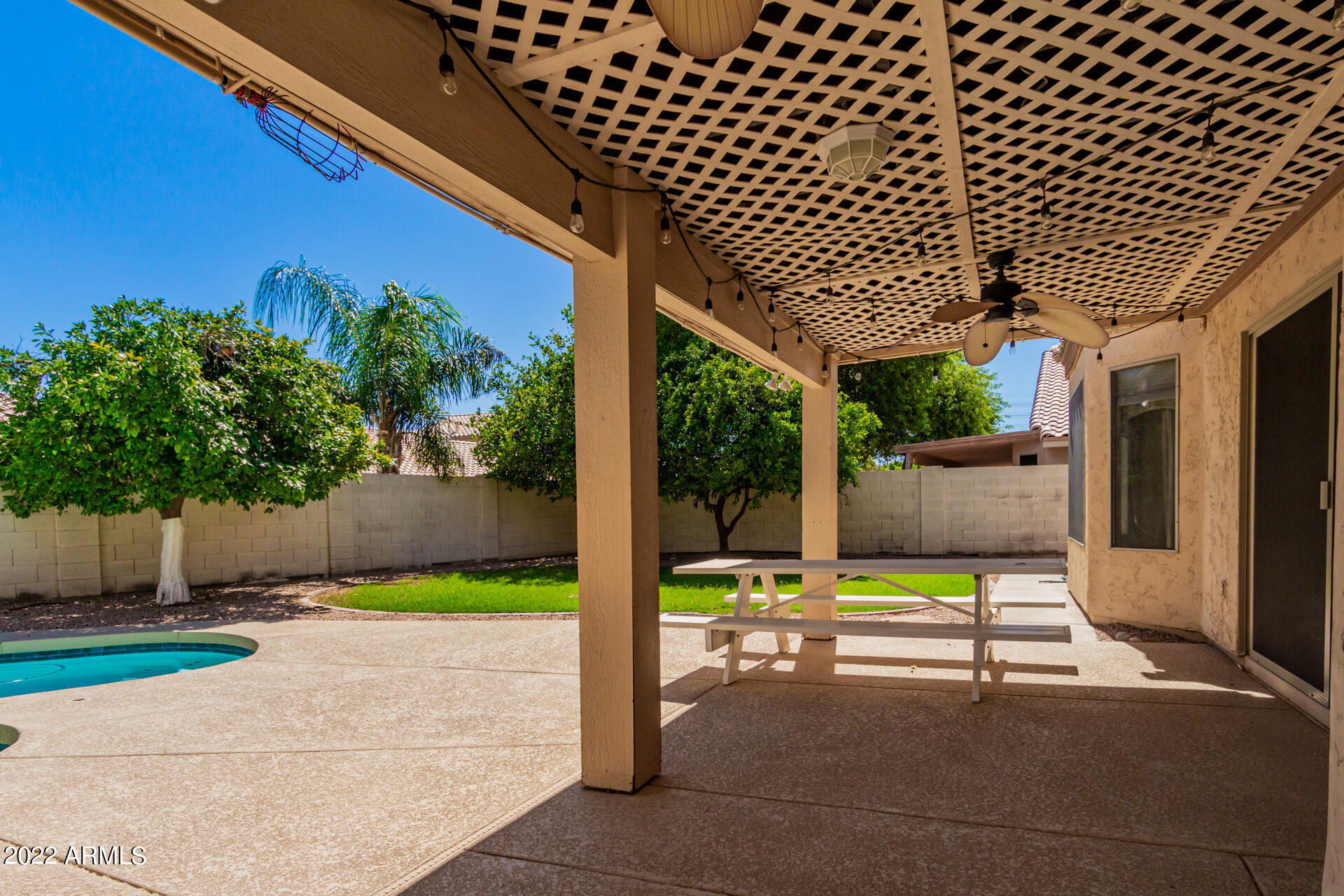 1647 East Heather Avenue Gilbert, AZ 85234 - Photo 23 of 27 a backyard of a house with yard and outdoor seating