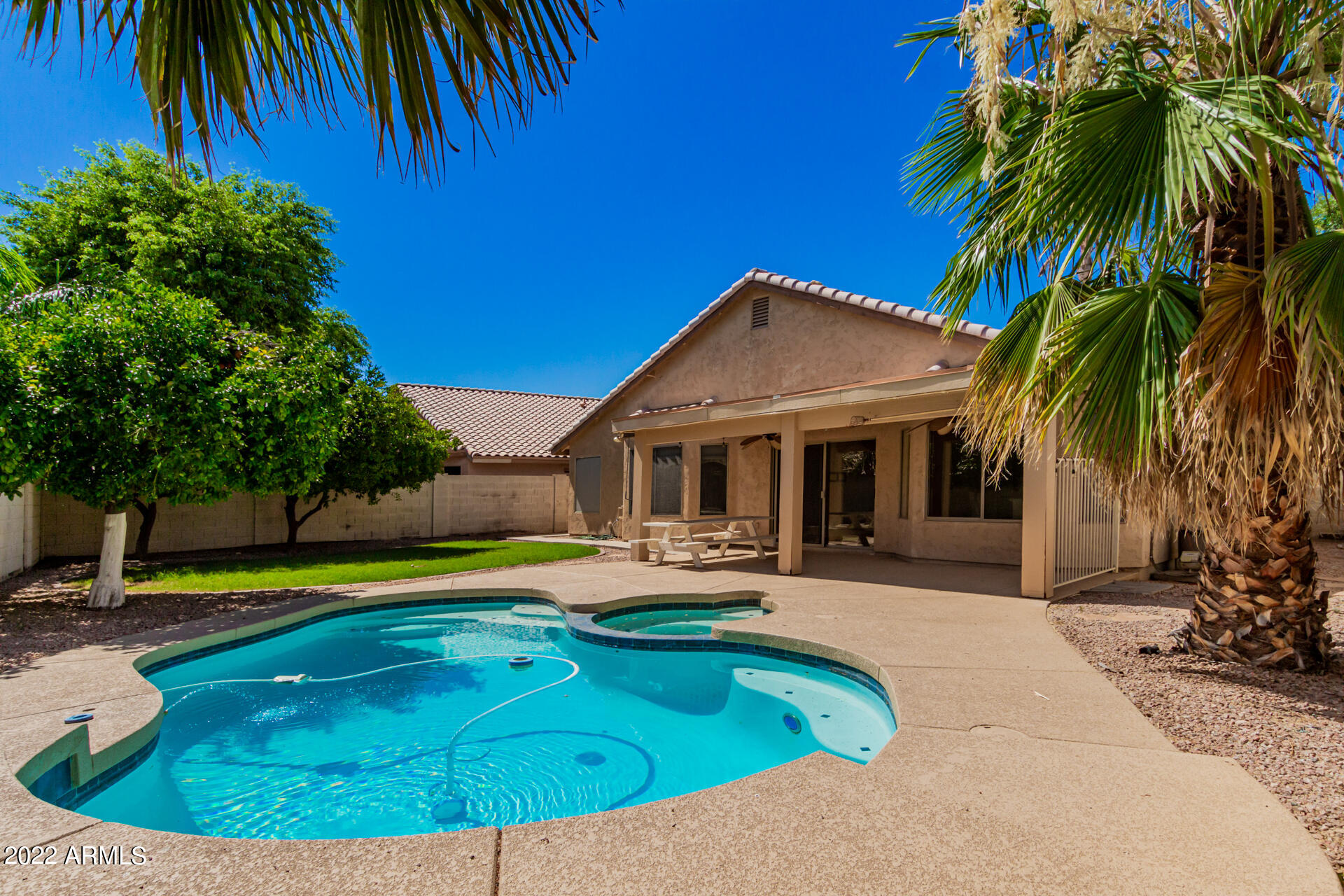 1647 East Heather Avenue Gilbert, AZ 85234 - Photo 25 of 27 a swimming pool with outdoor seating and yard