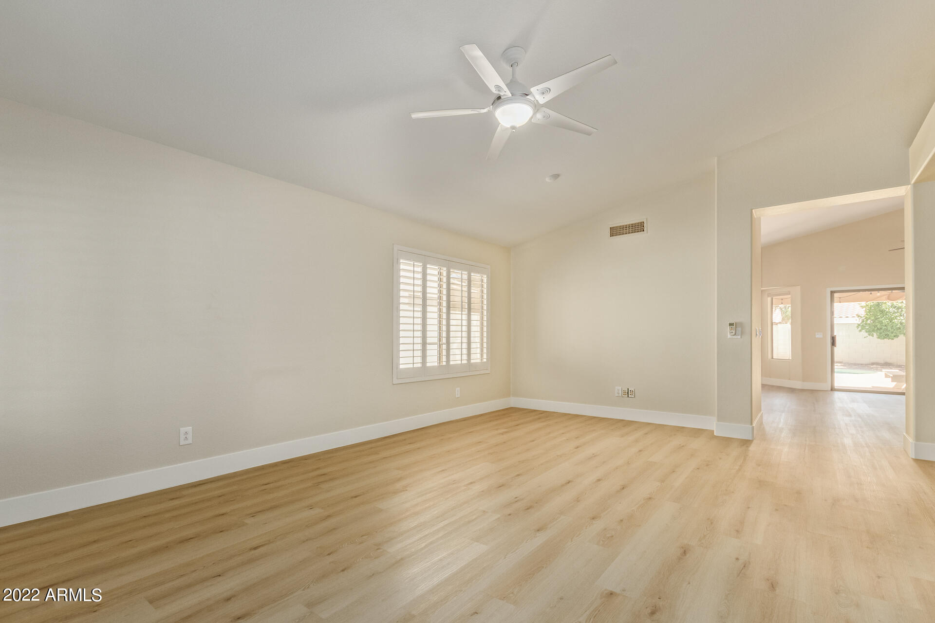 1647 East Heather Avenue Gilbert, AZ 85234 - Photo 5 of 27 wooden floor in an empty room with a window