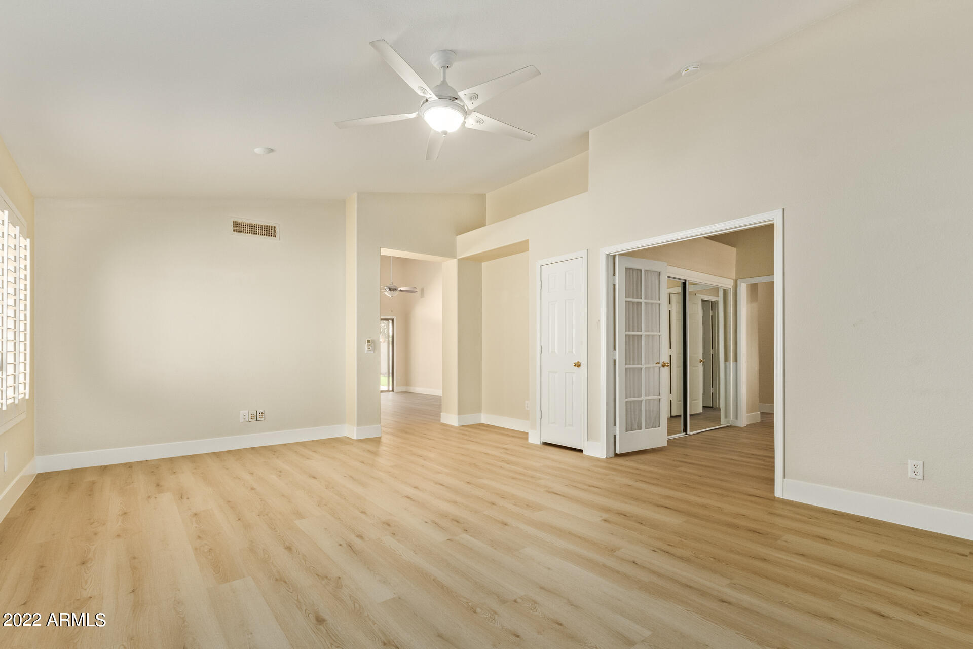 1647 East Heather Avenue Gilbert, AZ 85234 - Photo 6 of 27 an empty room with wooden floor and windows