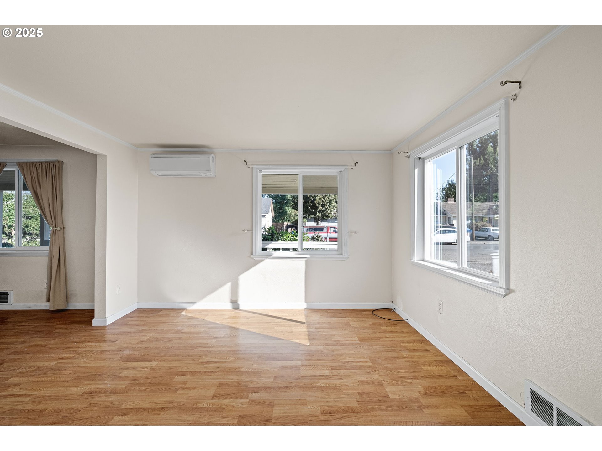 1917 Scott Road Springfield, OR 97477 - Photo 11 of 31 a view of an empty room with wooden floor and a window
