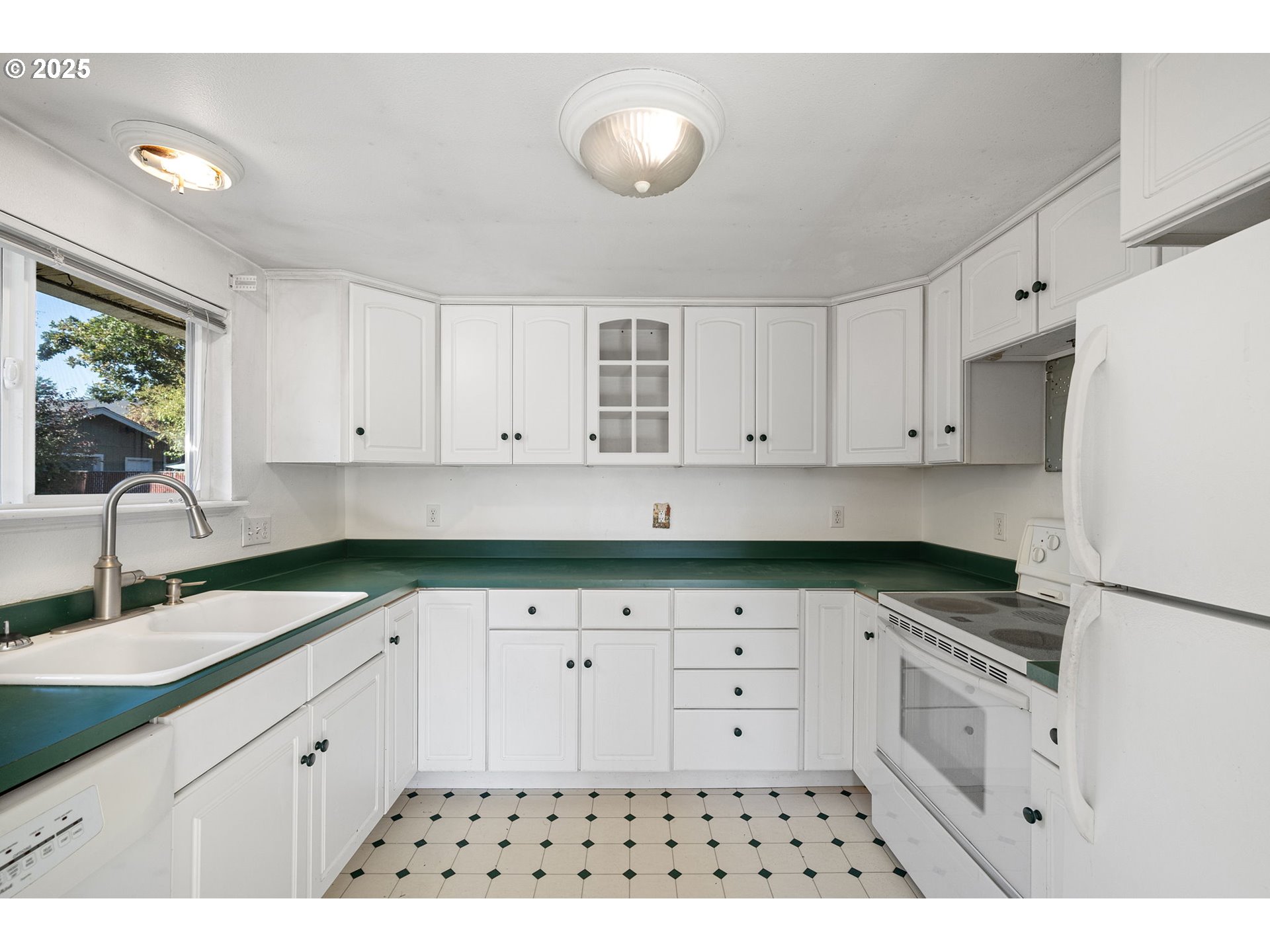 1917 Scott Road Springfield, OR 97477 - Photo 13 of 31 a kitchen with granite countertop a sink a stove a refrigerator and cabinets