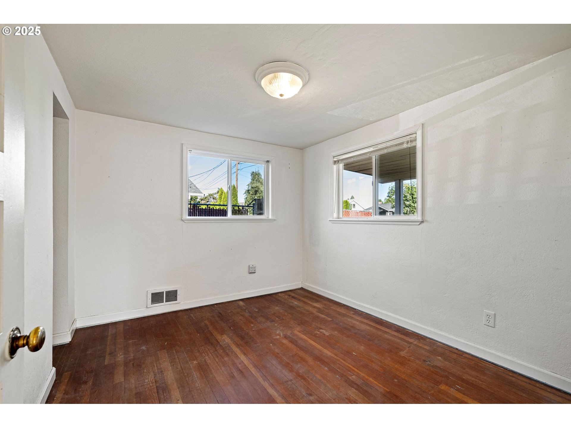 1917 Scott Road Springfield, OR 97477 - Photo 16 of 31 a view of an empty room with wooden floor and a window