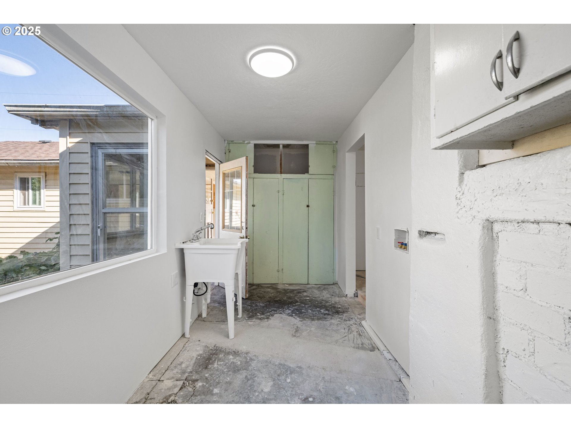1917 Scott Road Springfield, OR 97477 - Photo 24 of 31 a living room with a window and a wooden floor