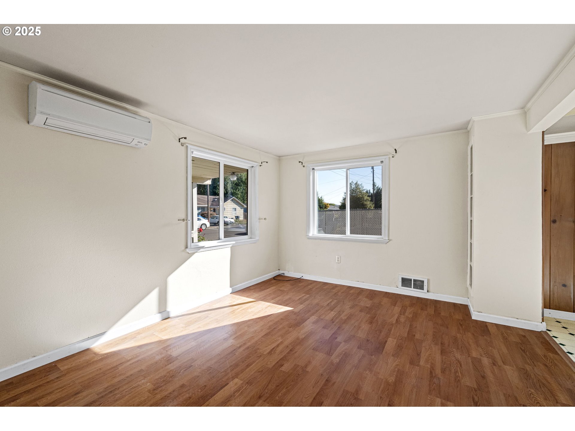 1917 Scott Road Springfield, OR 97477 - Photo 6 of 31 a view of an empty room with wooden floor and a window