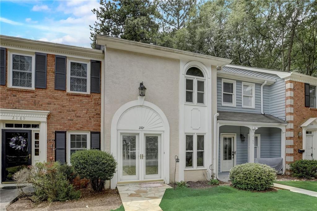 2187 Spring Walk Court Atlanta, GA 30341 - Photo 1 of 1 front view of a house with a yard