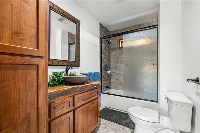 a living room with furniture and flat screen tv