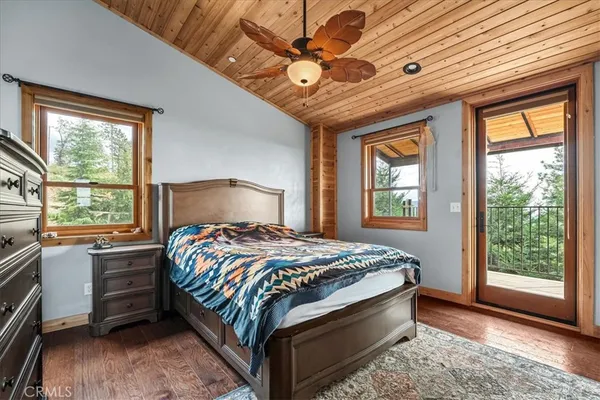 a living room with a large window and a table