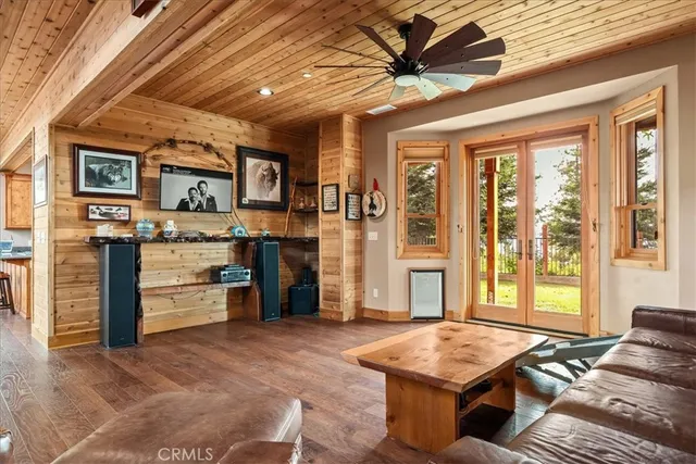 a living room with stainless steel appliances kitchen island granite countertop furniture and a kitchen view
