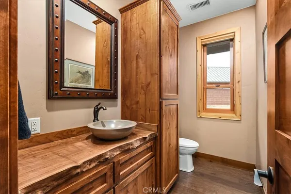 a bedroom with a bed and a cabinets