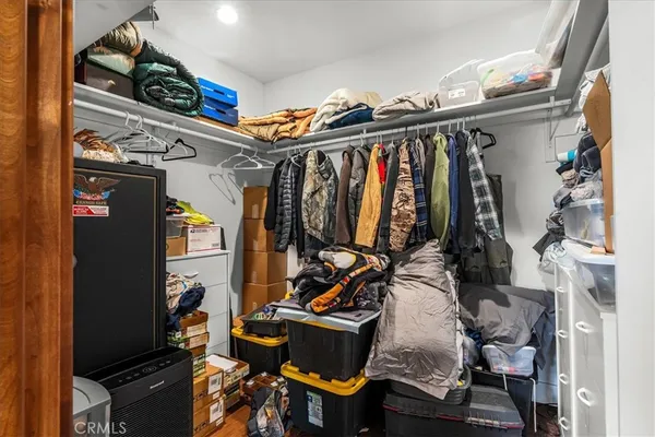 a view of a garage with rack and bicycle